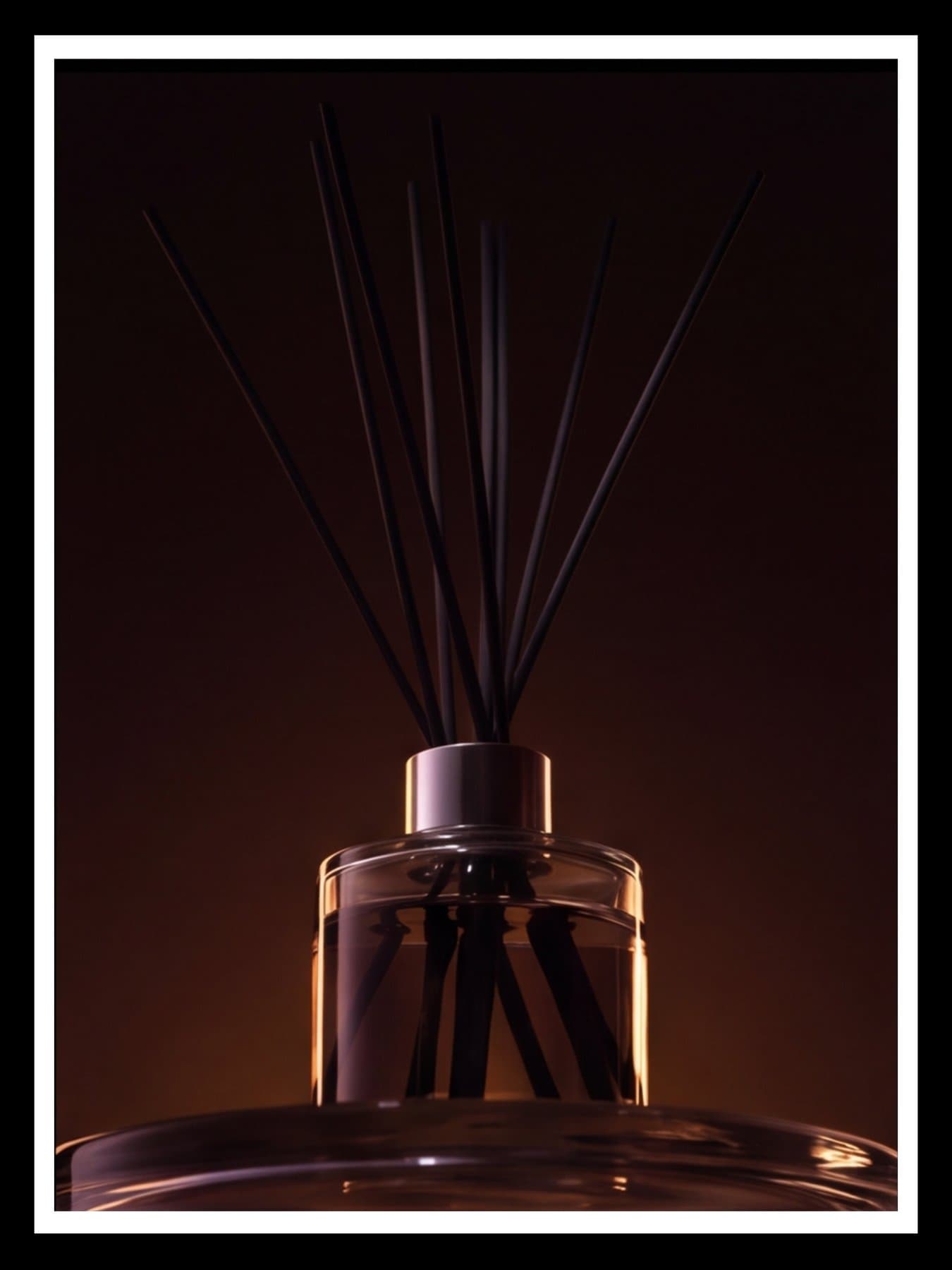 The reeds and the neck of the bottle, close
