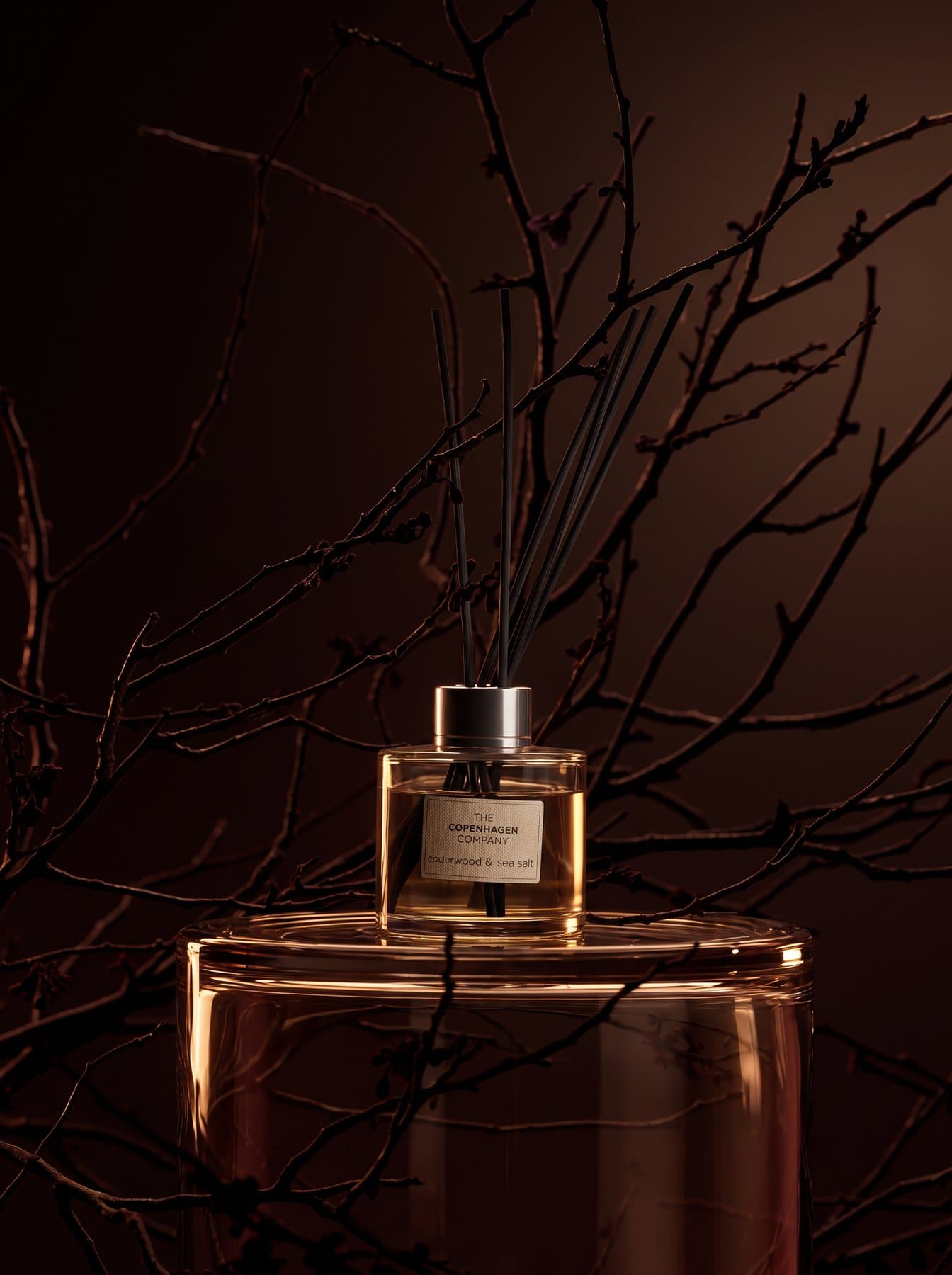 The Signature diffuser among branches, a warmer angle