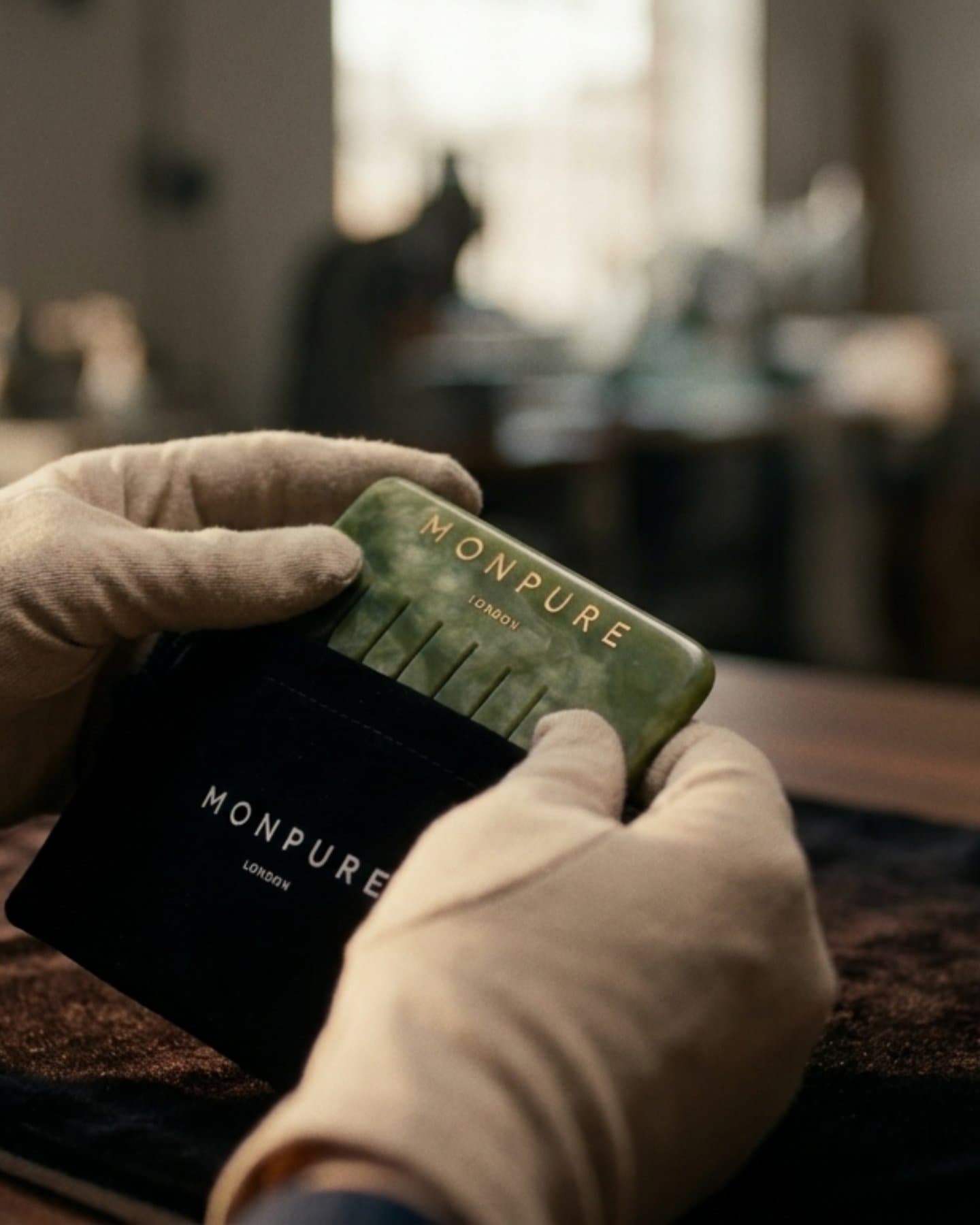 Gloved hands with the green card, upright