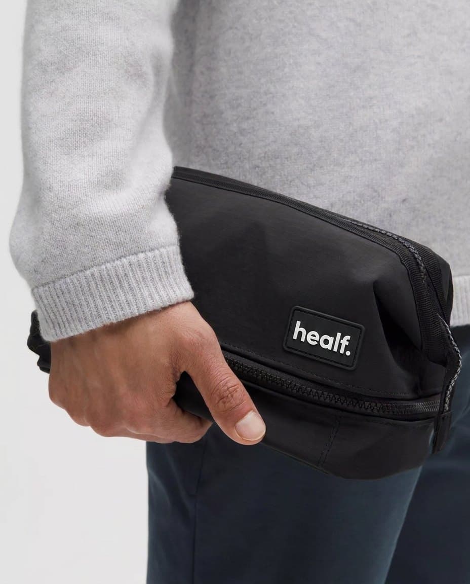 The black wash bag under an arm