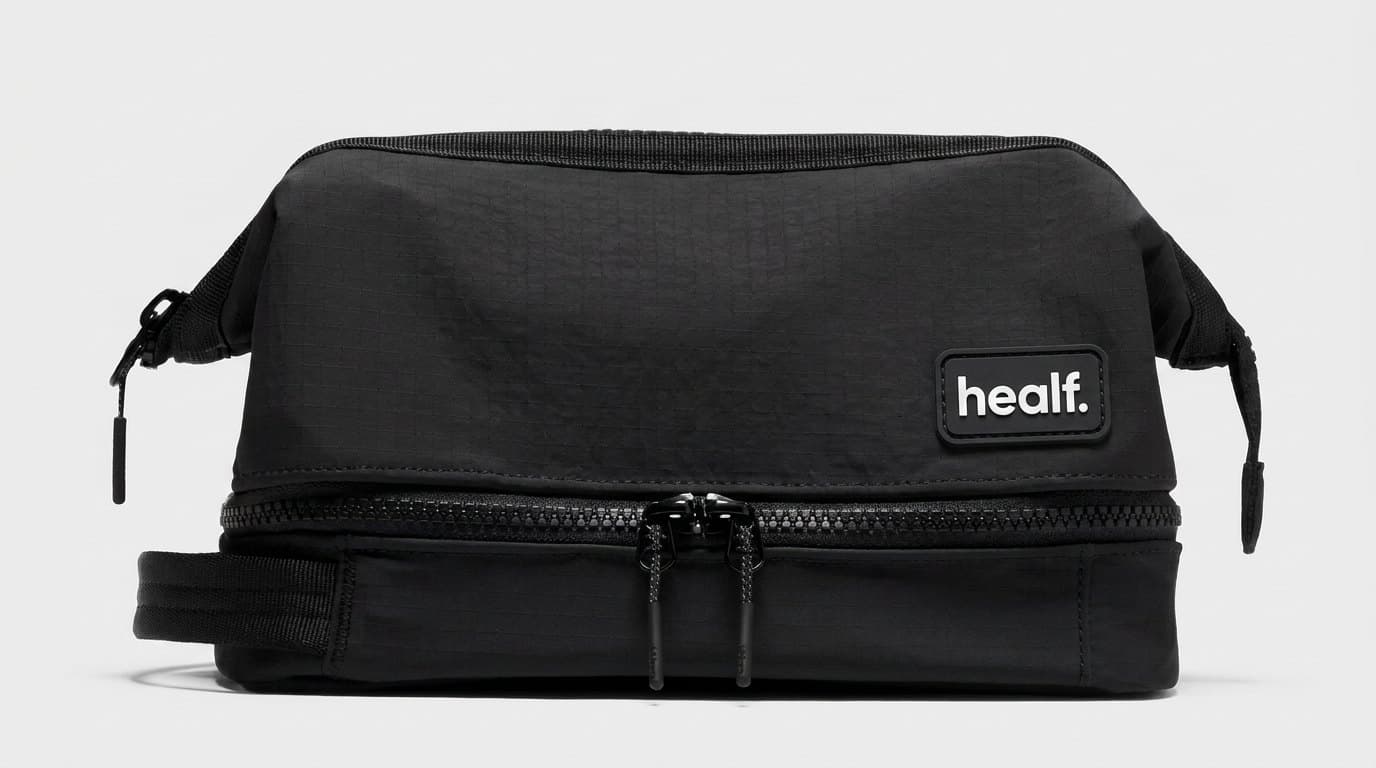 The black wash bag, its lower compartment open