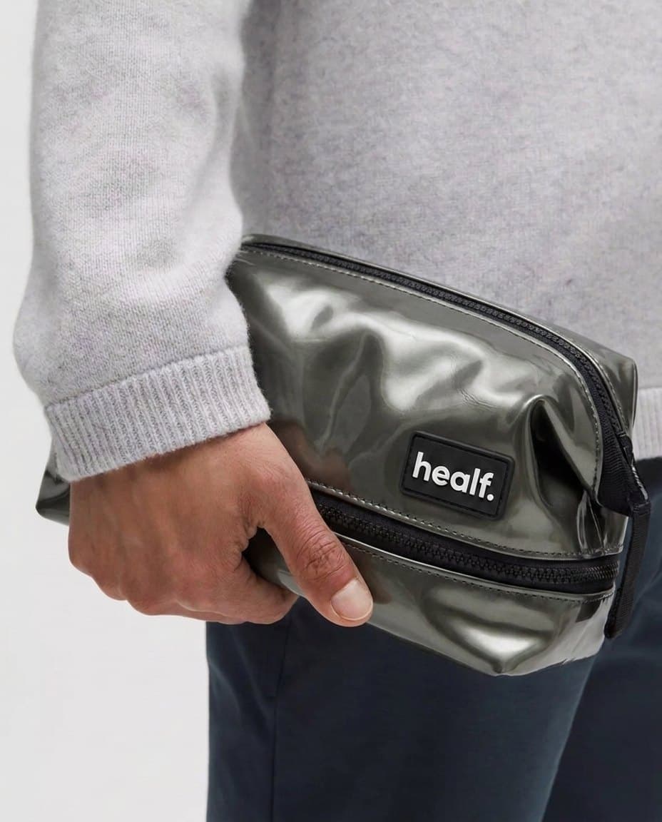 The silver wash bag held at the hip