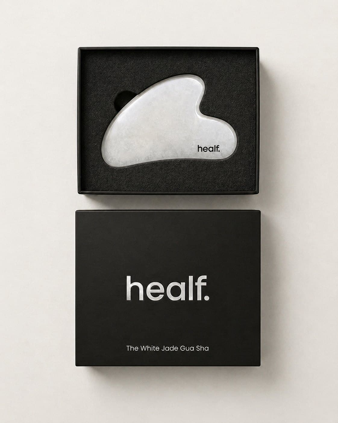 The white gua sha in its black box