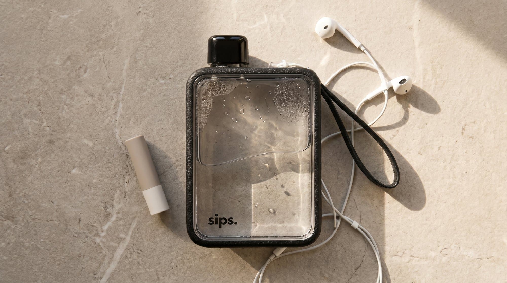 The bottle with earphones on marble