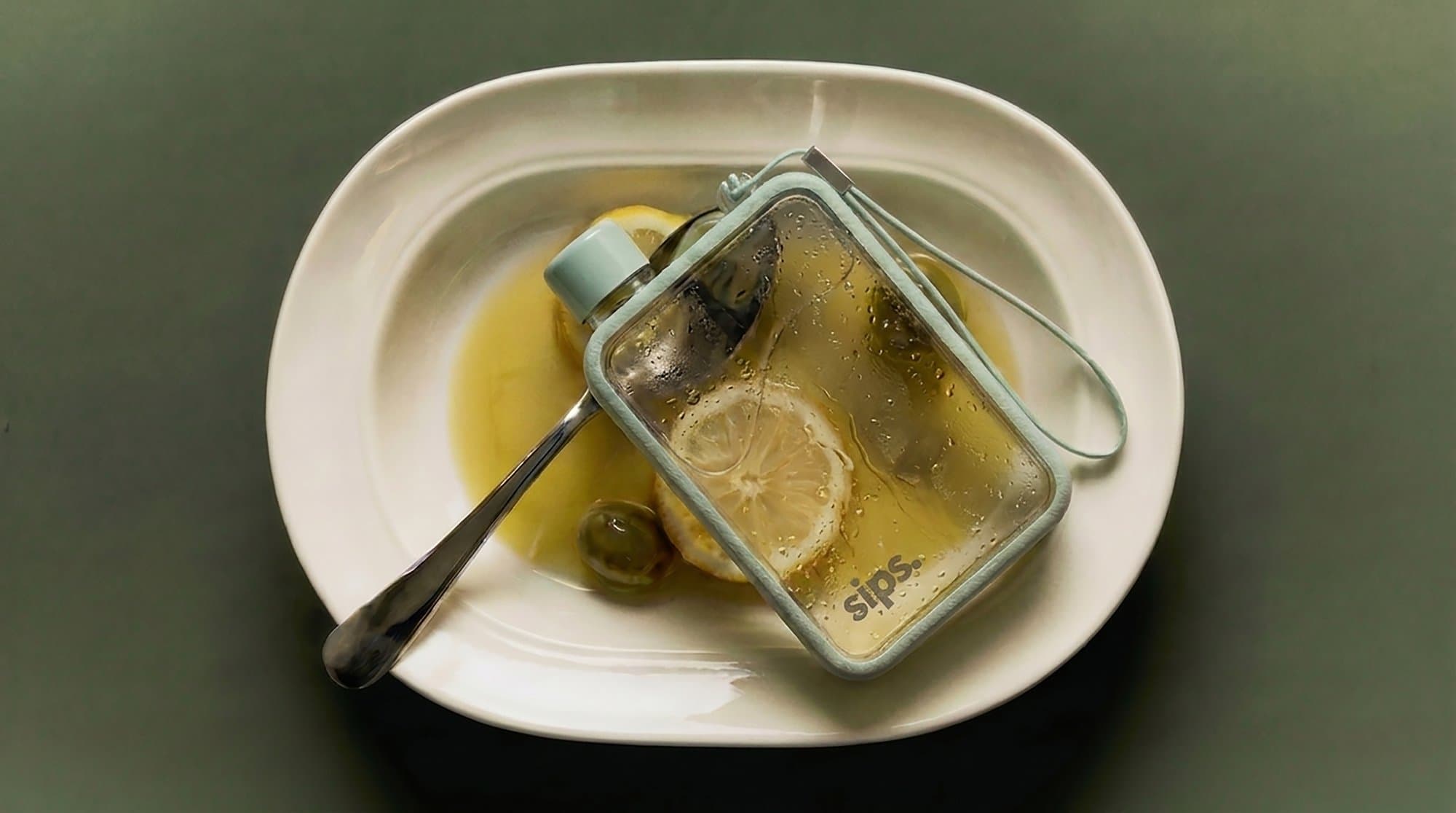The bottle on a plate, lid on
