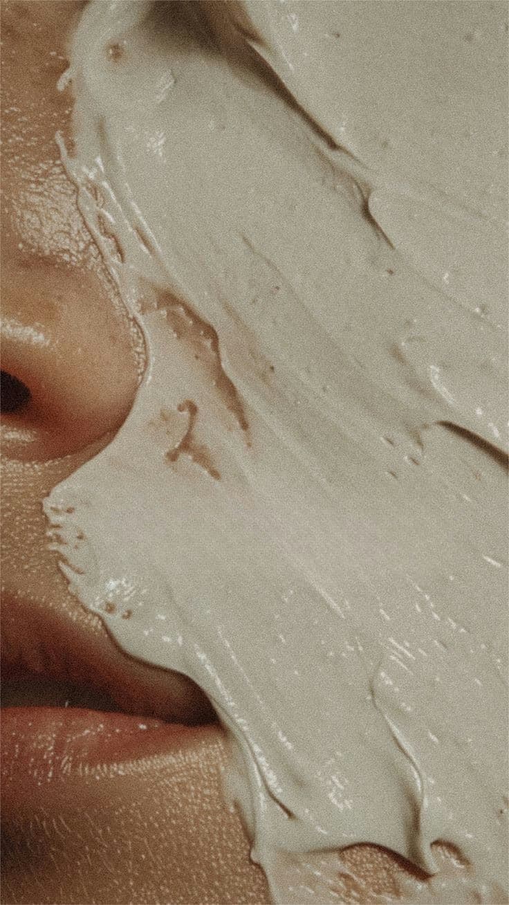 Cream texture across a face, close
